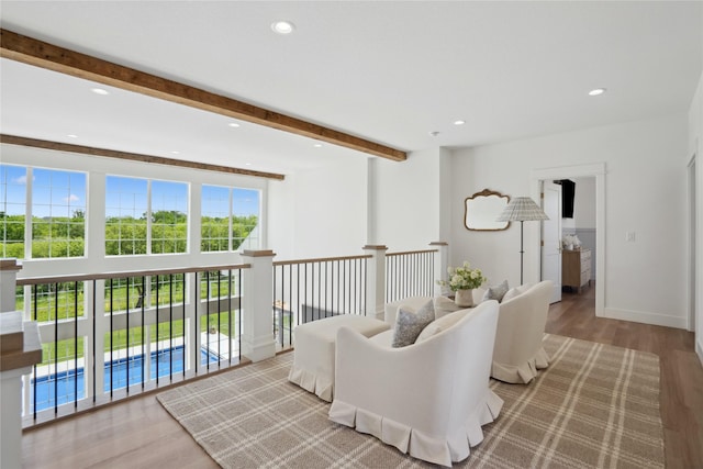 3834 NW 177th Ct, Clive, IA 50325 - living room with recessed lighting, wood finished floors, beam ceiling, and baseboards
