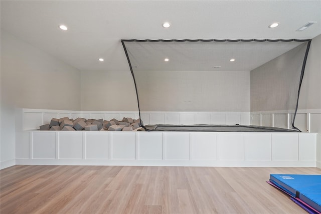 3834 NW 177th Ct, Clive, IA 50325 - exercise room featuring light wood finished floors and recessed lighting