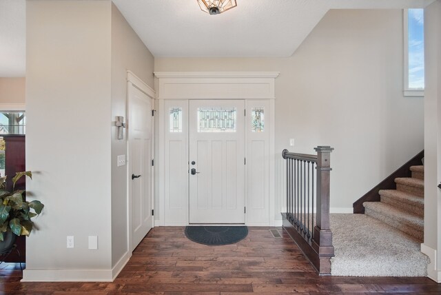 9012 NW 72nd Pl, Johnston, IA 50131 - entrance foyer featuring hardwood / wood-style flooring, plenty of natural light, and baseboards