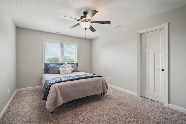 9012 NW 72nd Pl, Johnston, IA 50131 - bedroom with carpet, a textured ceiling, ceiling fan, and baseboards