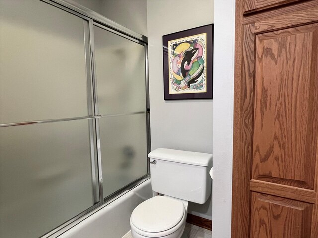 210 E 24th St N, Newton, IA 50208 - bathroom with shower / bath combination with glass door and toilet