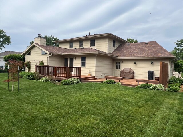 210 E 24th St N, Newton, IA 50208 - rear view of property with a wooden deck, a chimney, a yard, and roof with shingles