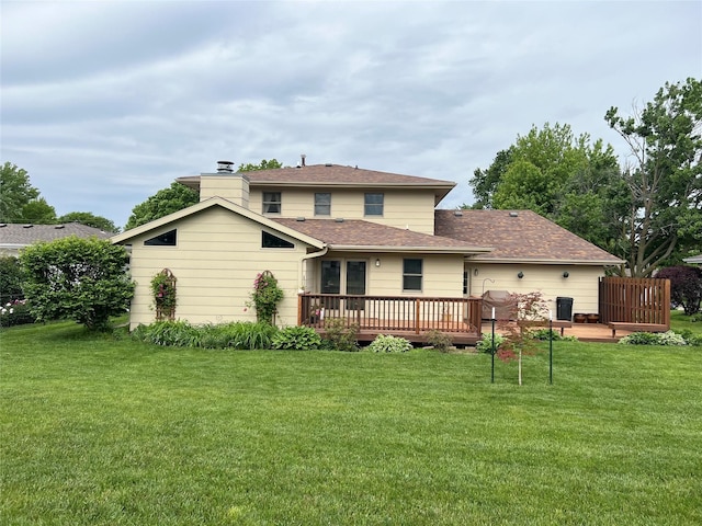 210 E 24th St N, Newton, IA 50208 - rear view of property featuring a deck and a yard