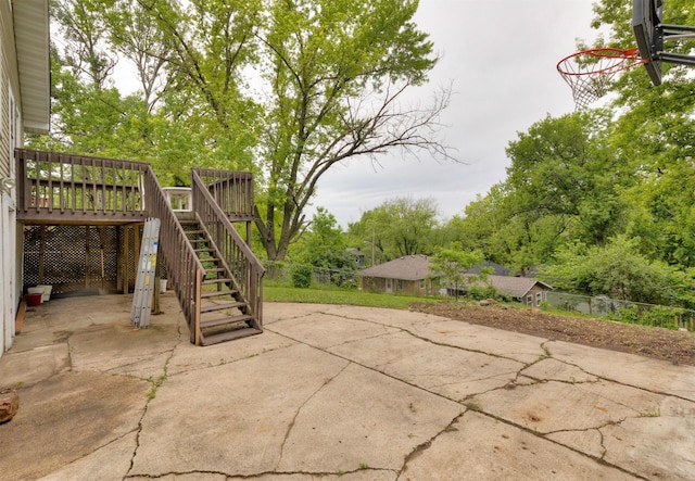 216 56th St, Des Moines, IA 50312 - view of patio / terrace featuring a wooden deck and stairs