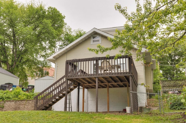 216 56th St, Des Moines, IA 50312 - rear view of house with stairway and a deck