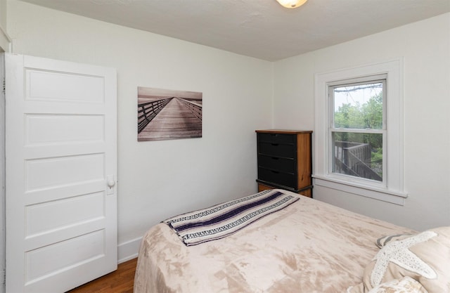 216 56th St, Des Moines, IA 50312 - bedroom featuring wood finished floors