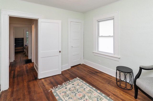 216 56th St, Des Moines, IA 50312 - living area with ornamental molding, dark wood finished floors, and baseboards