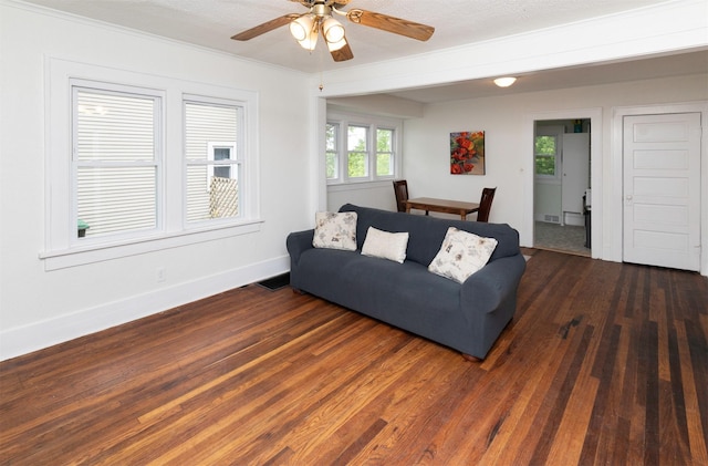 216 56th St, Des Moines, IA 50312 - living room featuring wood finished floors, crown molding, baseboards, and ceiling fan