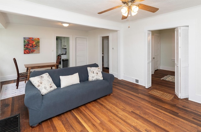 216 56th St, Des Moines, IA 50312 - living area featuring ceiling fan, baseboards, wood finished floors, and crown molding