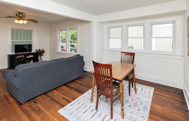 216 56th St, Des Moines, IA 50312 - dining room with a ceiling fan, dark wood-type flooring, baseboards, and ornamental molding