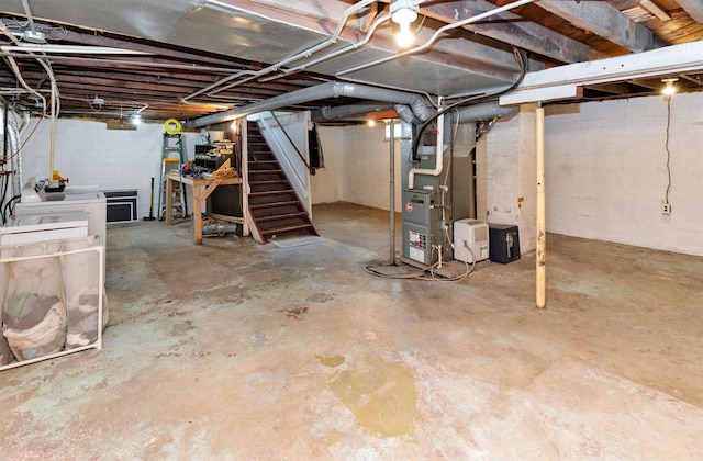 216 56th St, Des Moines, IA 50312 - unfinished basement featuring stairs and heating unit