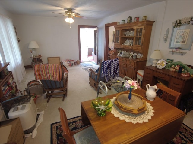 627 7th St, Nevada, IA 50201 - dining area featuring ceiling fan and light colored carpet