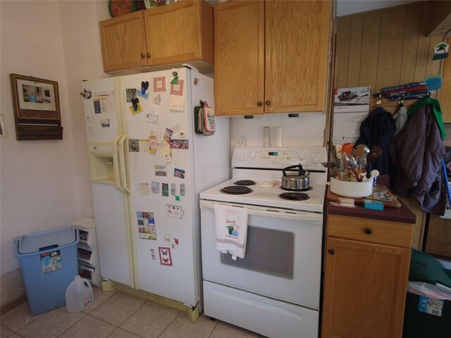 627 7th St, Nevada, IA 50201 - kitchen with white appliances, light tile patterned flooring, and tasteful backsplash
