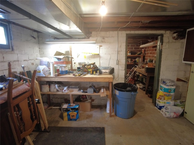 627 7th St, Nevada, IA 50201 - below grade area with a workshop area and concrete block wall