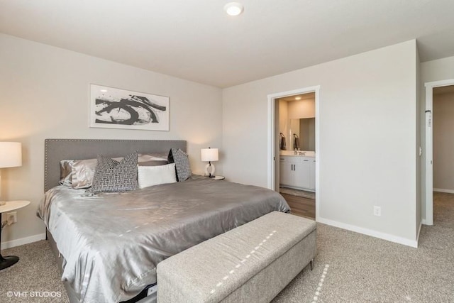 14225 Walnut Meadows Dr, Urbandale, IA 50323 - bedroom with baseboards, carpet flooring, and connected bathroom