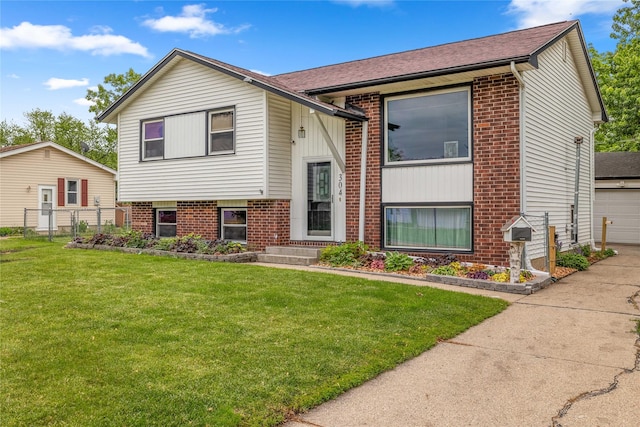 304 11th St SE, Altoona, IA 50009 - split foyer home with brick siding, a garage, and a shingled roof