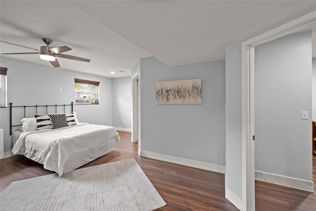 304 11th St SE, Altoona, IA 50009 - bedroom featuring wood finished floors, baseboards, and a ceiling fan