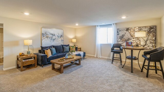 1001 NE 12th St, Grimes, IA 50111 - living area with carpet flooring, recessed lighting, and baseboards