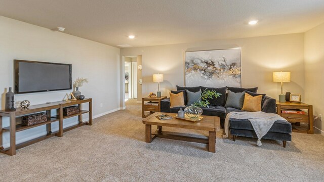 1001 NE 12th St, Grimes, IA 50111 - living room featuring light colored carpet, recessed lighting, and baseboards