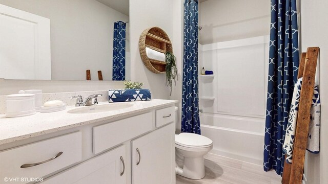 1001 NE 12th St, Grimes, IA 50111 - full bath with vanity, toilet, and shower / bath combination with curtain