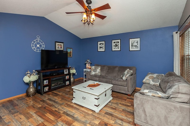 2518 E 39th Ct, Des Moines, IA 50317 - living room with vaulted ceiling, a ceiling fan, wood finished floors, and baseboards