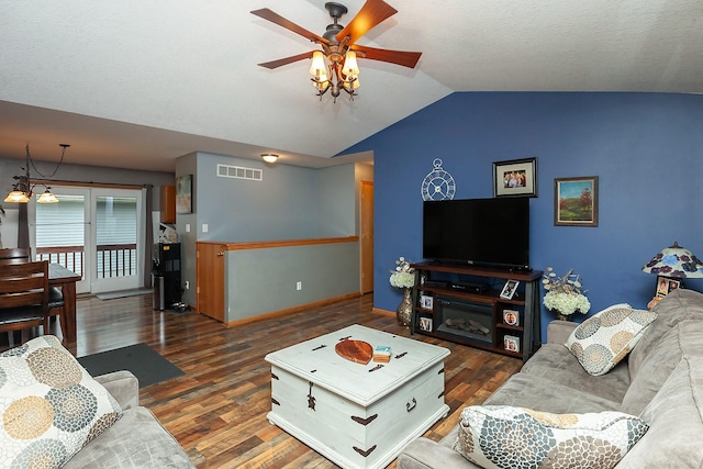 2518 E 39th Ct, Des Moines, IA 50317 - living room featuring vaulted ceiling, wood finished floors, a ceiling fan, and baseboards