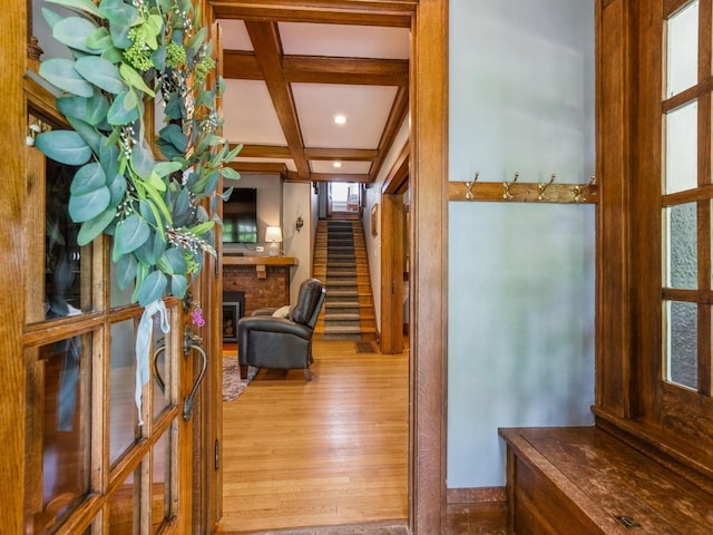 912 45th St, Des Moines, IA 50312 - corridor featuring coffered ceiling, wood finished floors, stairway, beam ceiling, and recessed lighting