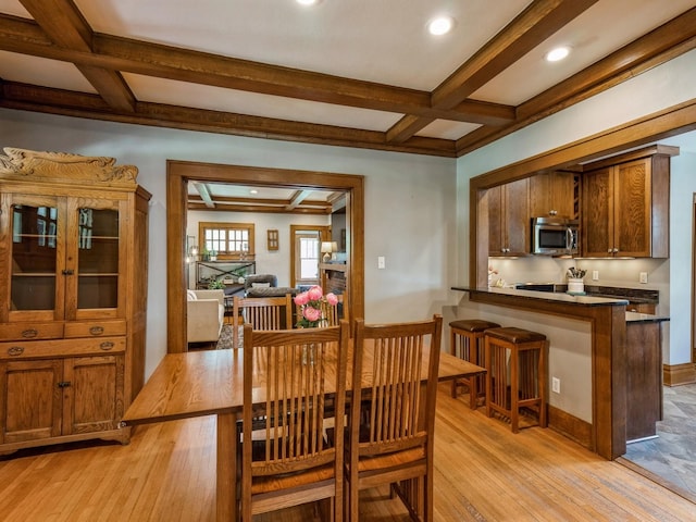 912 45th St, Des Moines, IA 50312 - dining area featuring light wood finished floors, beamed ceiling, coffered ceiling, and recessed lighting
