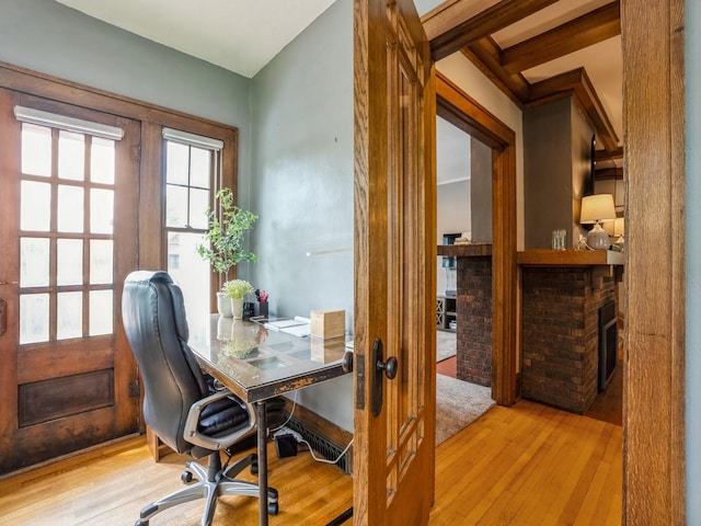 912 45th St, Des Moines, IA 50312 - office with hardwood / wood-style flooring, a brick fireplace, and french doors