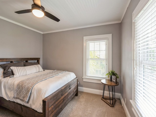 912 45th St, Des Moines, IA 50312 - carpeted bedroom with baseboards, crown molding, and ceiling fan