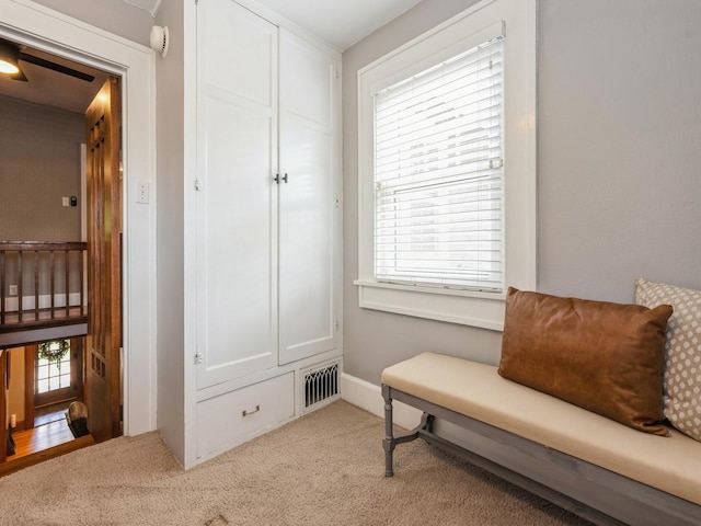 912 45th St, Des Moines, IA 50312 - living area featuring light carpet and baseboards