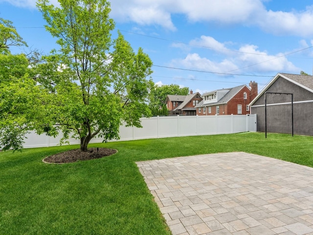 912 45th St, Des Moines, IA 50312 - view of yard featuring a patio