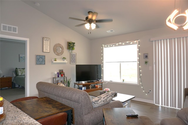 507 W Madison St, Winterset, IA 50273 - living room featuring lofted ceiling, ceiling fan, dark wood-type flooring, and baseboards