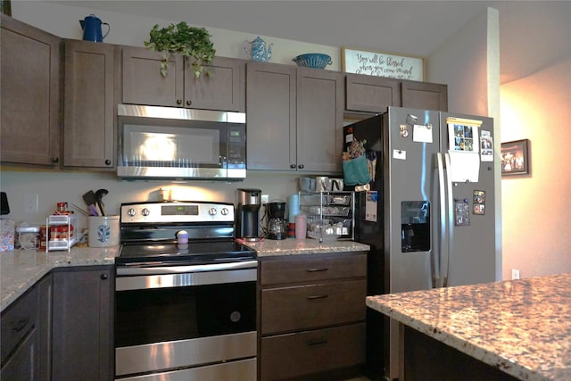 507 W Madison St, Winterset, IA 50273 - kitchen with stainless steel appliances and light stone countertops