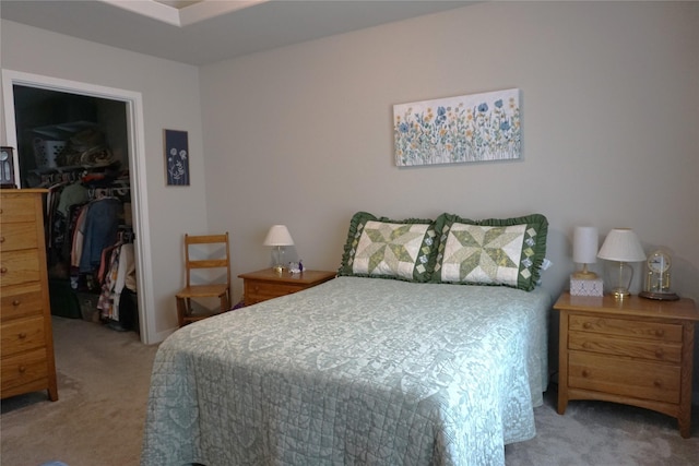 507 W Madison St, Winterset, IA 50273 - carpeted bedroom featuring a spacious closet and a closet