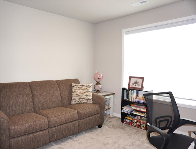 507 W Madison St, Winterset, IA 50273 - carpeted home office featuring baseboards