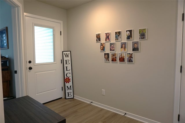 507 W Madison St, Winterset, IA 50273 - doorway to outside with light wood finished floors and baseboards