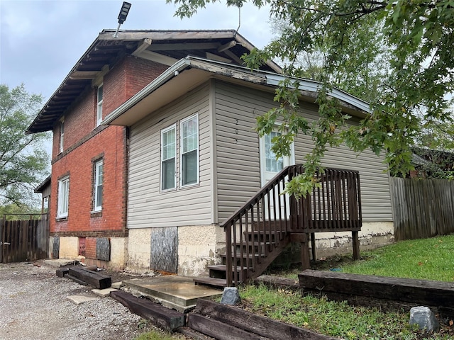 205 N 2nd St, Mystic, IA 52574 - view of side of property with brick siding