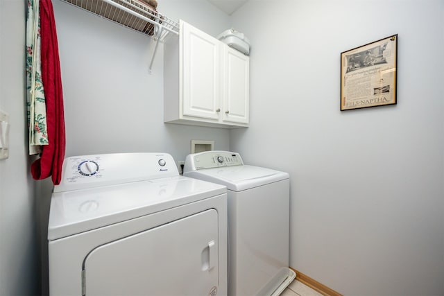 3739 155th Ct, Urbandale, IA 50323 - laundry room featuring washer and dryer, cabinet space, and baseboards