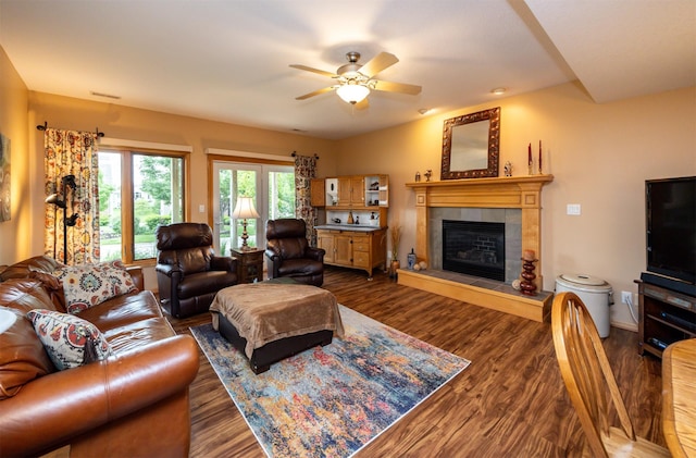 3739 155th Ct, Urbandale, IA 50323 - living area featuring a fireplace, dark wood finished floors, and a ceiling fan
