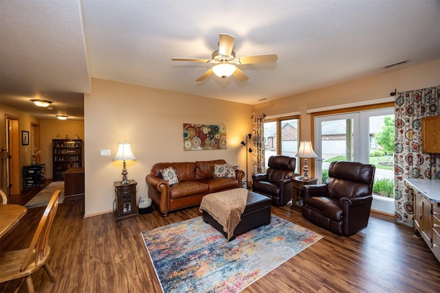 3739 155th Ct, Urbandale, IA 50323 - living room featuring dark wood-type flooring, a ceiling fan, and baseboards