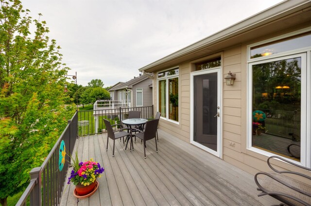 3739 155th Ct, Urbandale, IA 50323 - wooden terrace featuring outdoor dining space