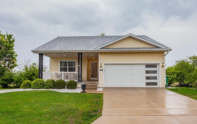 604 SE 18th St, Grimes, IA 50111 - view of front of property featuring a front lawn, a porch, concrete driveway, and an attached garage