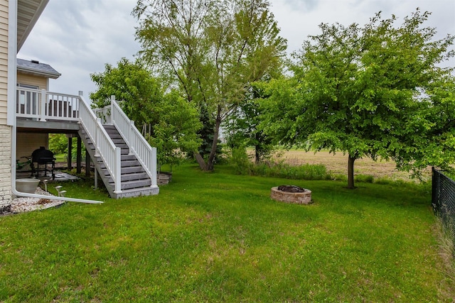 604 SE 18th St, Grimes, IA 50111 - view of yard with stairs, an outdoor fire pit, and a deck