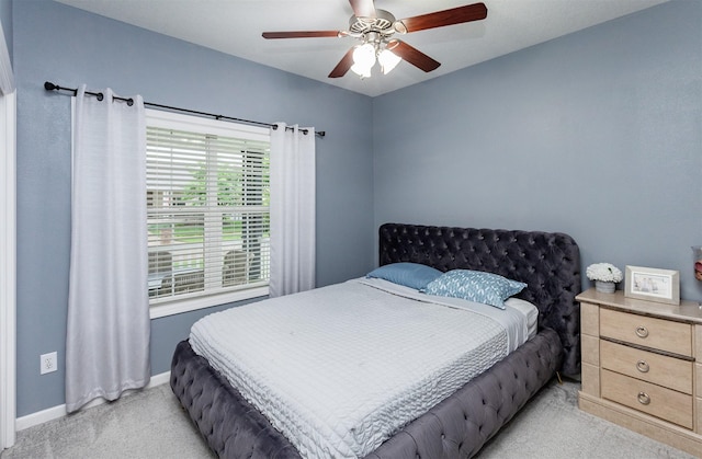 604 SE 18th St, Grimes, IA 50111 - bedroom featuring light carpet, baseboards, and a ceiling fan