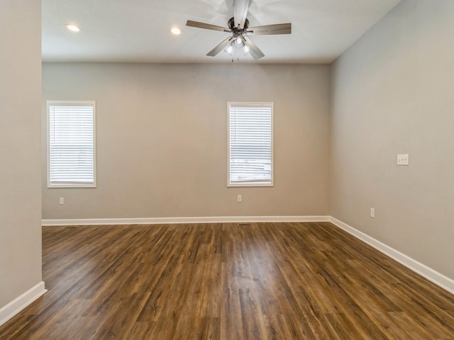 601 S 3rd Ave E, Newton, IA 50208 - empty room featuring plenty of natural light, baseboards, dark wood-type flooring, and recessed lighting