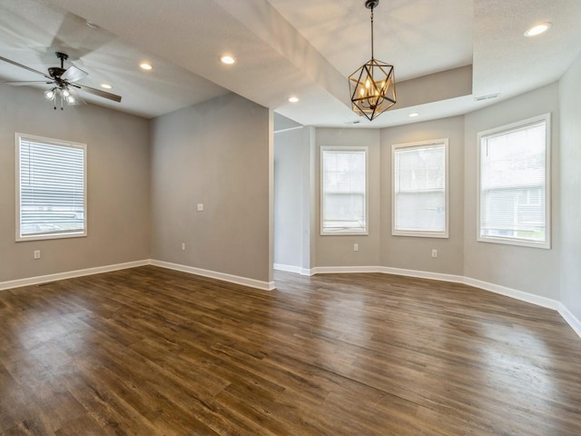 601 S 3rd Ave E, Newton, IA 50208 - empty room featuring a chandelier, dark wood-type flooring, baseboards, ceiling fan, and recessed lighting