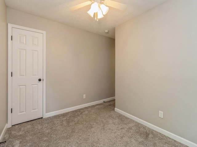 601 S 3rd Ave E, Newton, IA 50208 - carpeted spare room featuring a ceiling fan and baseboards