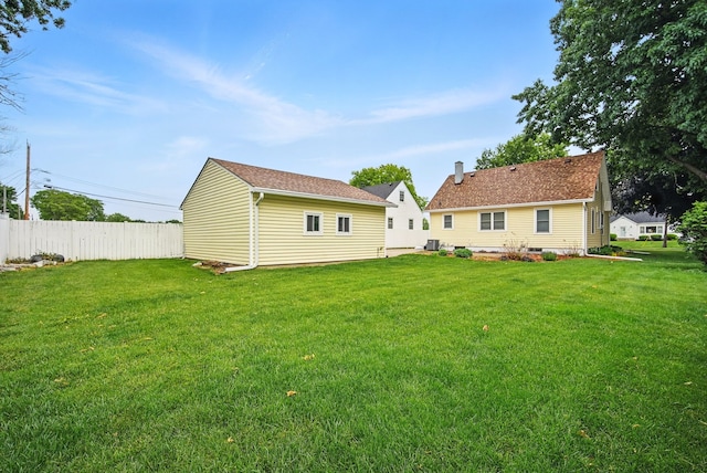 7105 Madison Ave, Urbandale, IA 50322 - back of house with an outbuilding