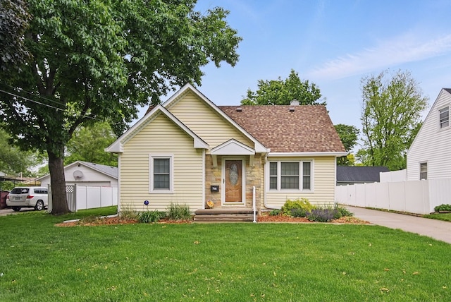 7105 Madison Ave, Urbandale, IA 50322 - bungalow-style house with stone siding and a shingled roof